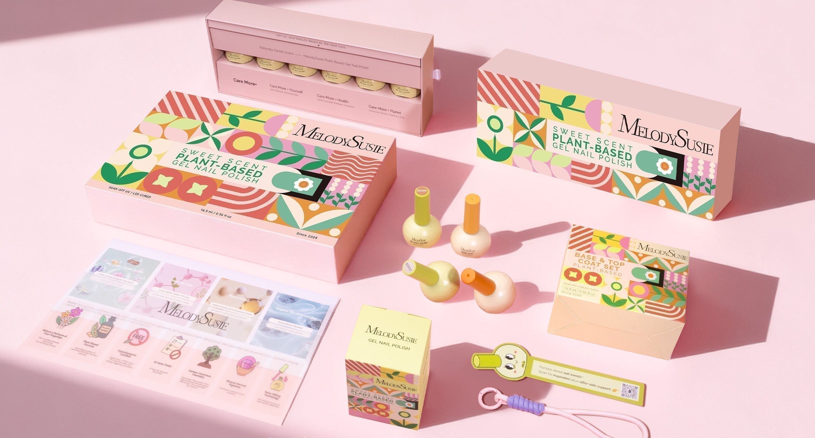  A product arrangement showcasing various MelodySusie Sweet Scent Plant-Based Gel Nail Polish box sets and accessories on a pink surface.