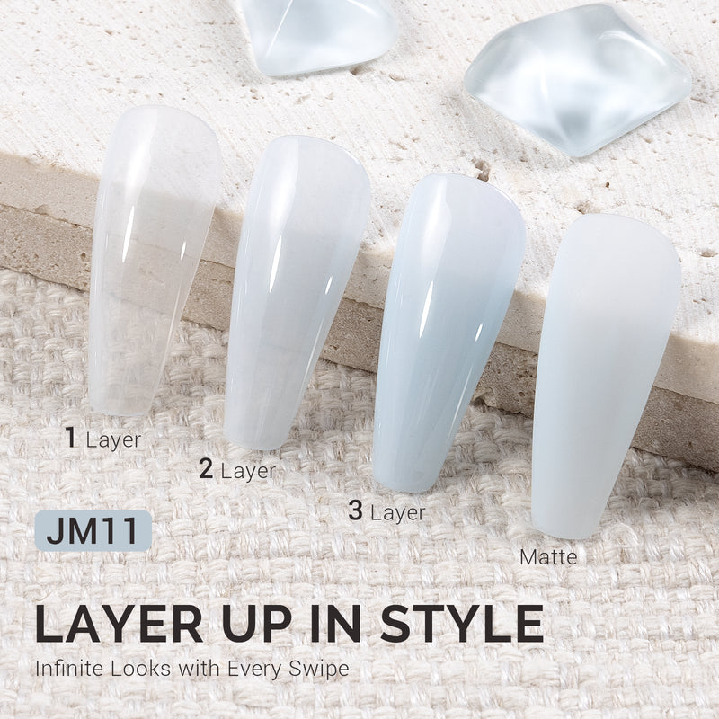 Jeweliver Blue Aquamarine jelly gel polish JM11 showing water-like translucent ocean blue finish on nail buildable from sheer to deep coverage