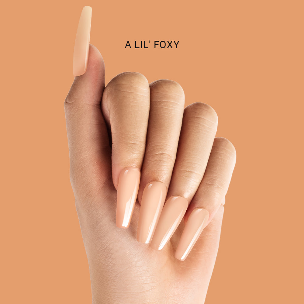 MelodySusie A Lil Foxy acrylic powder showing warm coral nude shade flattering for spring skin tones and clean girl aesthetic