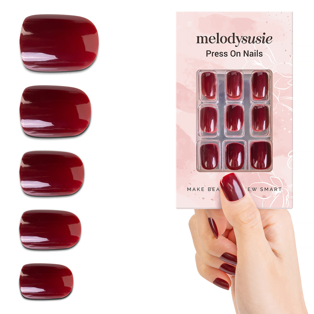 Scarlet deep red bold press on nails statement prom manicure pairs with red black emerald gown confident entrance formal event
